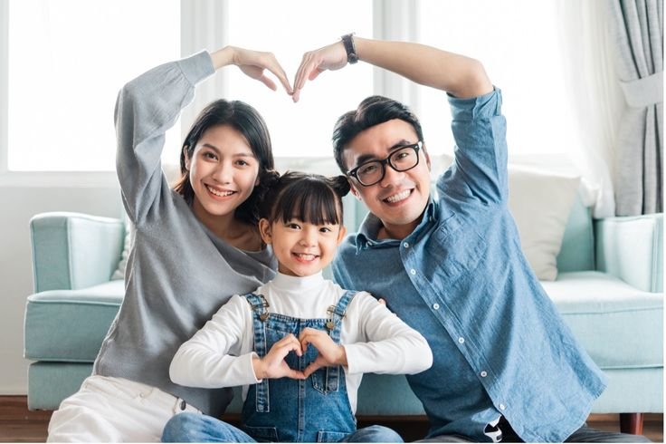 Happy family with home